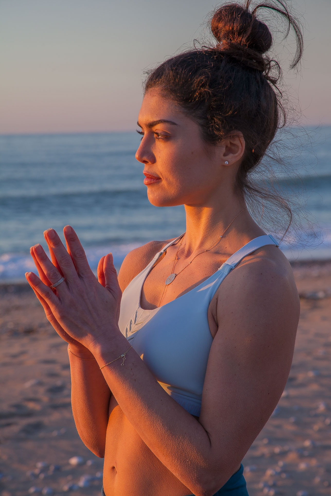 Tracy Estefane, Yoga teacher with hands in prayer